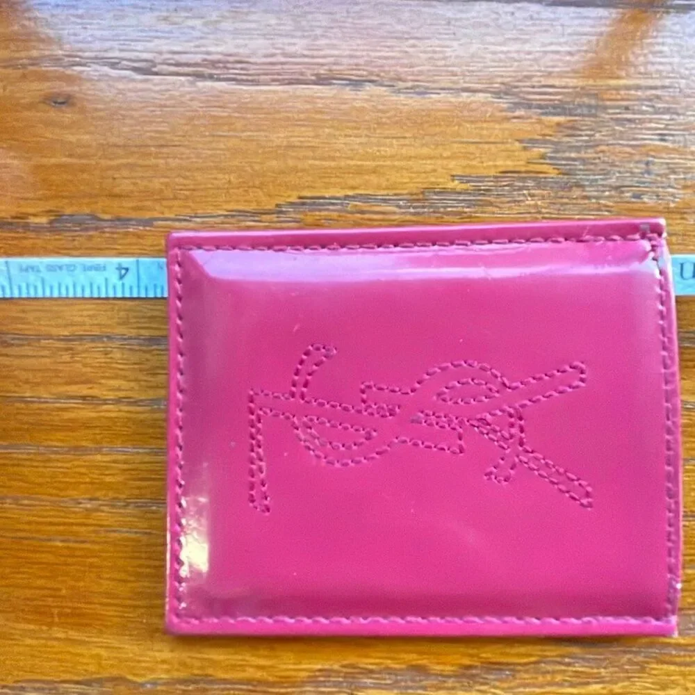 Yves Saint Laurent Beaute Fuchia and gold handbag mirror set.